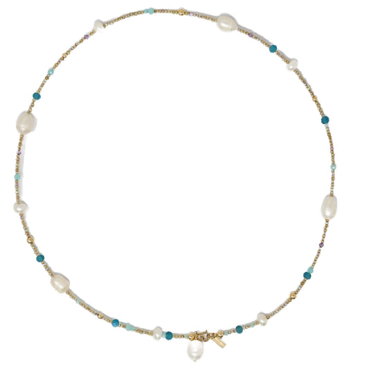 A handcrafted necklace with blue amazonite beads, amethyst beads, gold-filled details, and a pearl charm clasp.