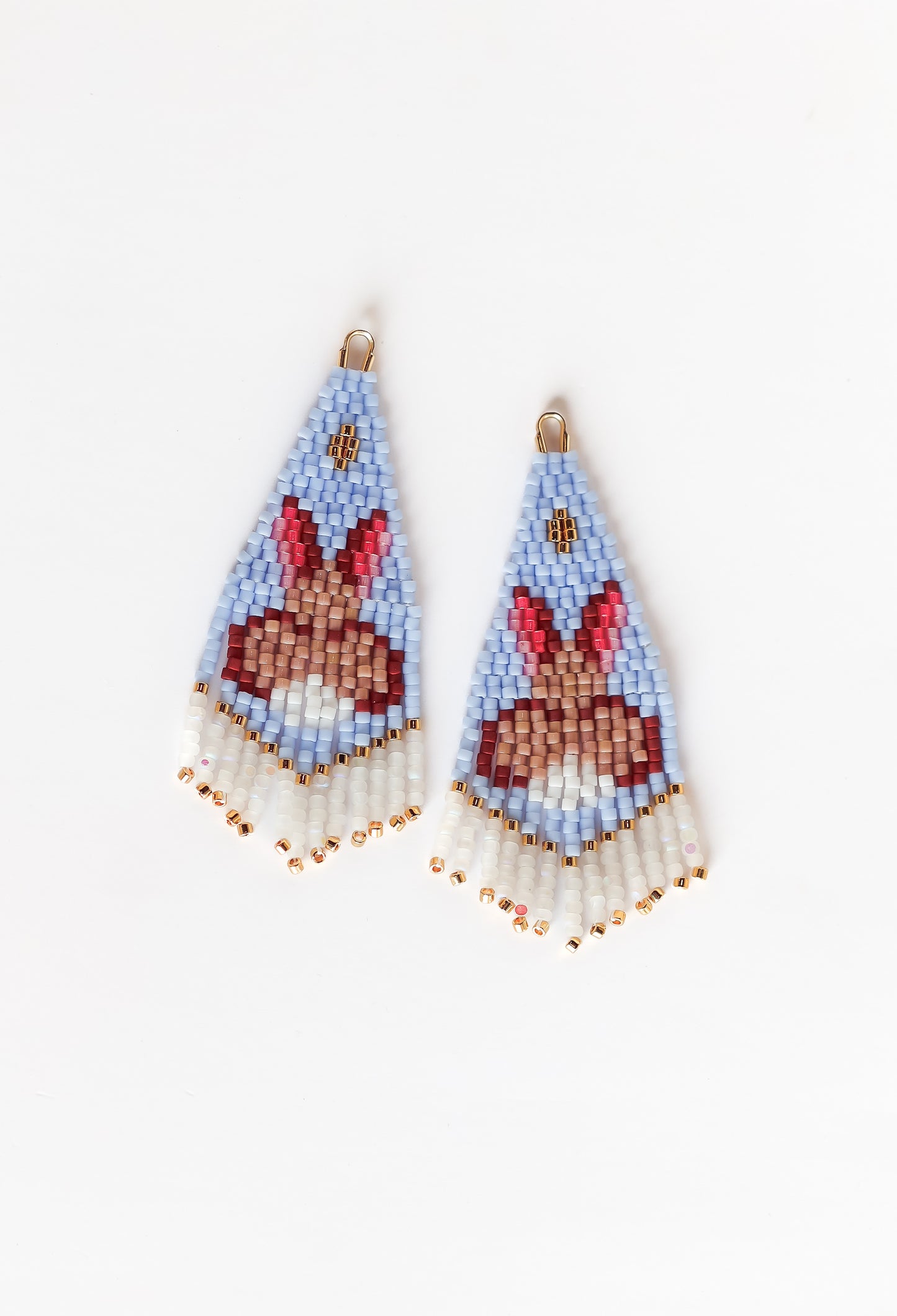 Beaded earrings with rabbit design on a white background
