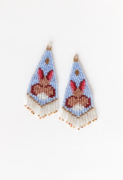 Beaded earrings with rabbit design on a white background