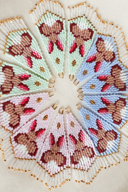 Twelve beaded earrings featuring a bunny design