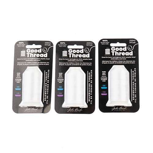 Three packages of Good Thread threaders on a white background