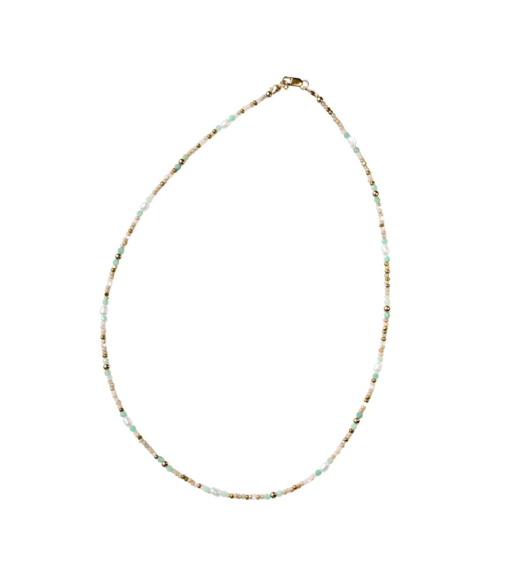 Necklace with small beads on a white background