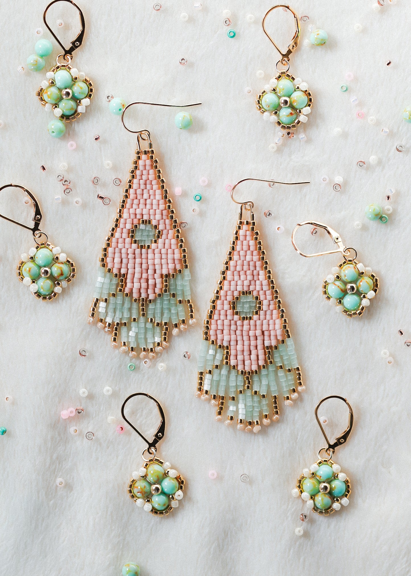 Set of handmade beaded earrings on a light background
