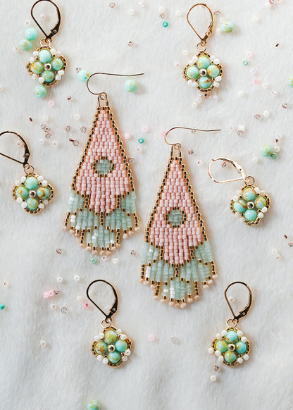 Set of handmade beaded earrings on a light background