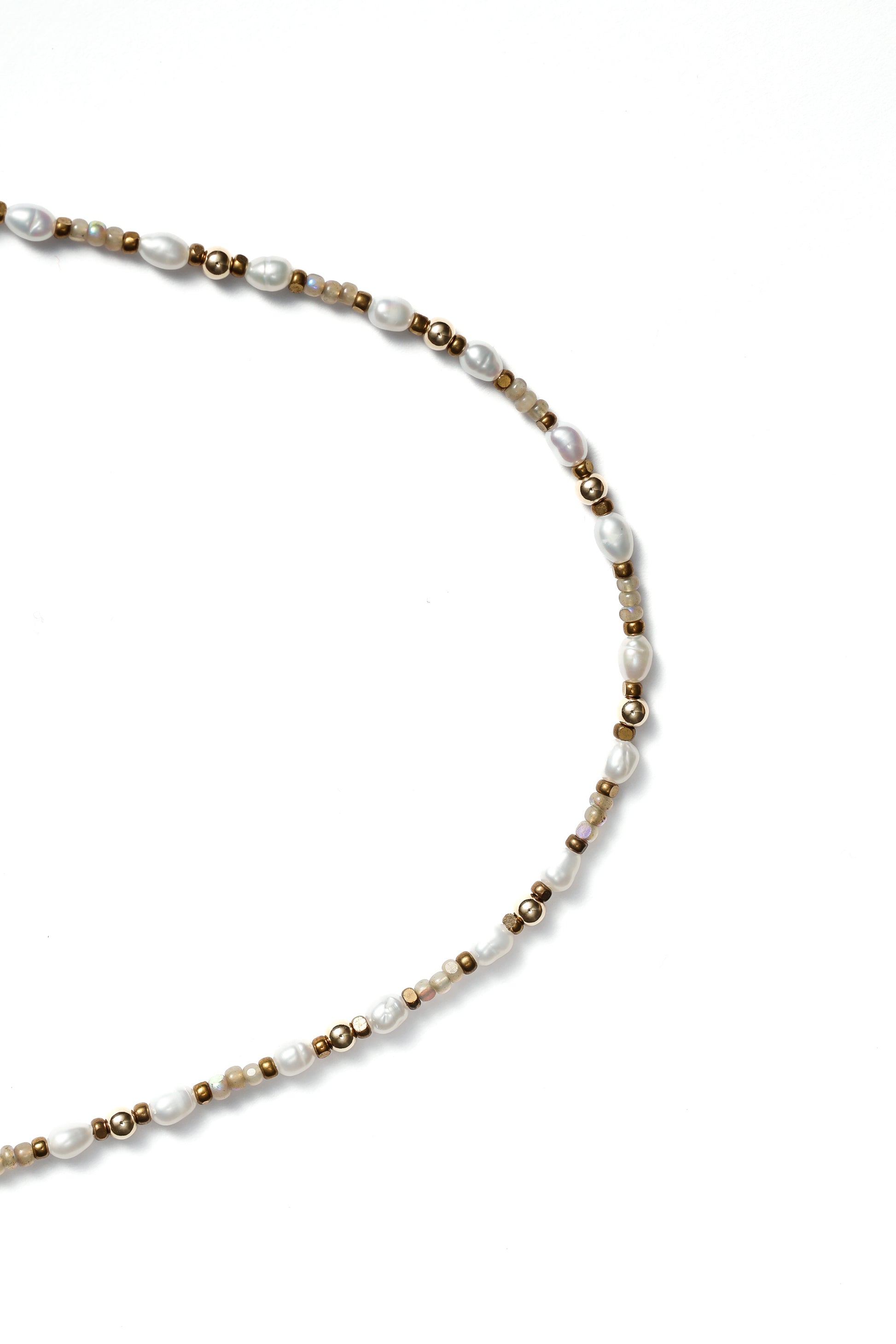 Closeup of a beaded necklace on a white background