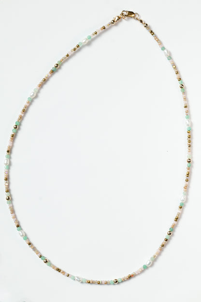 Necklace with small beads on a white background