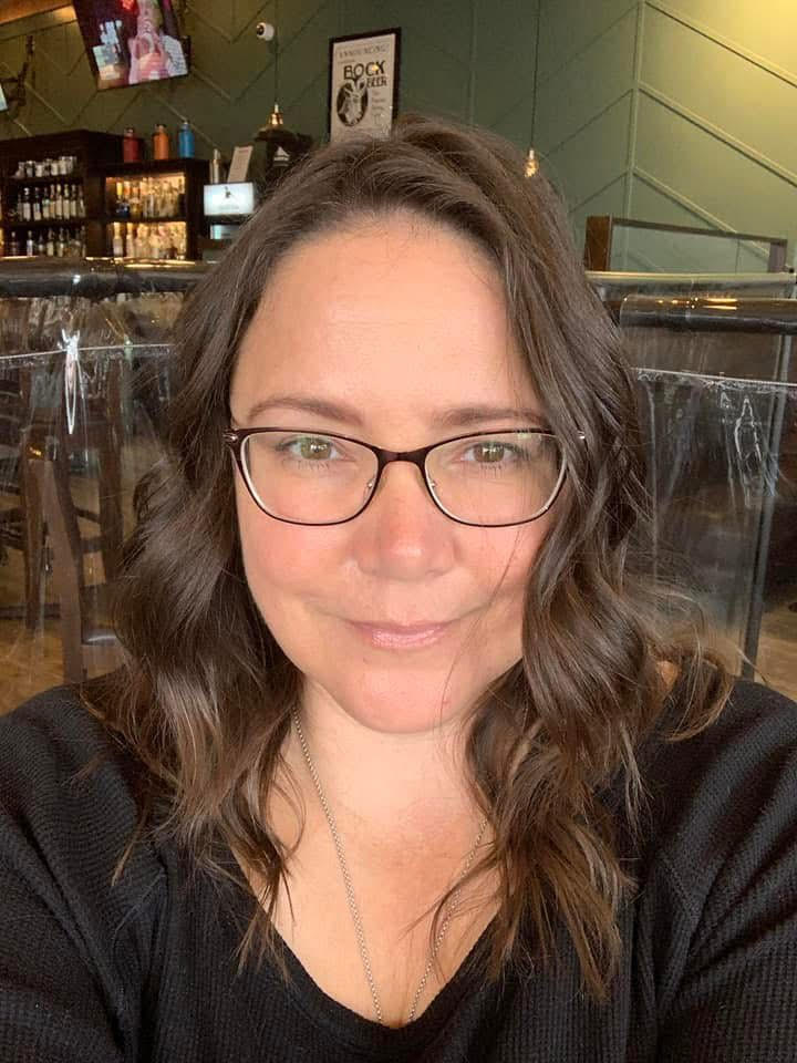 Woman with glasses in a casual setting